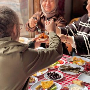 people sharing breakfast food